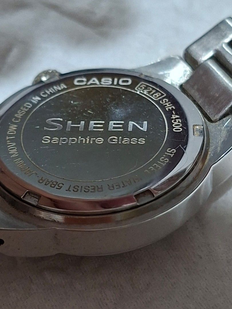 Casio Sheen Analog Watch with Date Display (Category: Women's Watches) located in Bulacan. Submitted by rafaesarisari (Listing ID 1466672532, Image 2). Description: - Brand/Model: Casio Sheen Women's Watch - Dial: Dark brown textured dial with clear date window at 3 o'clock - Bezel: Elegant crystal markers set around the bezel - Movement: Reliable Japan movement - Band: Silver-tone stainless steel bracelet with standard crown - Condition: Normal 
