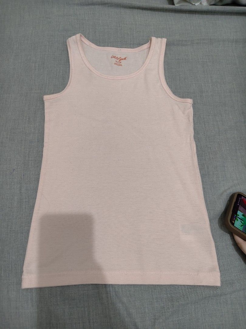 Cat & Jack Pink Tank Top Size M 7/8 (Category: Babies & Kids Fashion) located in Mandaluyong City. Submitted by declutterpreloved2.0 (Listing ID 1466770195, Image 1). Description: - Brand: Cat & Jack - Color: Light Pink - Size: M (Fits ages 7 to 8 years) - Material: Soft and breathable cotton - Features: Classic sleeveless cut with ribbed neckline trim - Origin: Made in Vietnam - Condition: Great for everyday layering and casual wear.
