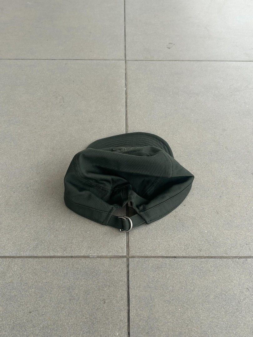 Celine Dark Green Cadet Cap (Category: Caps & Hats) located in Pasig City. Submitted by paulclzdo (Listing ID 1466639147, Image 3). Description: - Brand: Celine - Style: Cadet Cap - Color: Dark Green - Size: Medium (M) - Details: Embroidered Triomphe logo on the front - Closure: Adjustable metal strap at the back - Condition: Clean interior lining with original brand labels attached.