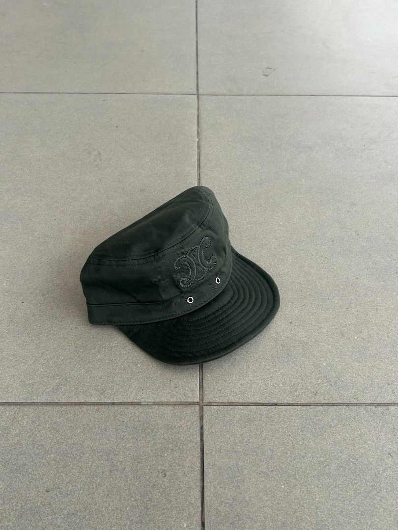 Celine Dark Green Cadet Cap (Category: Caps & Hats) located in Pasig City. Submitted by paulclzdo (Listing ID 1466639147, Image 2). Description: - Brand: Celine - Style: Cadet Cap - Color: Dark Green - Size: Medium (M) - Details: Embroidered Triomphe logo on the front - Closure: Adjustable metal strap at the back - Condition: Clean interior lining with original brand labels attached.