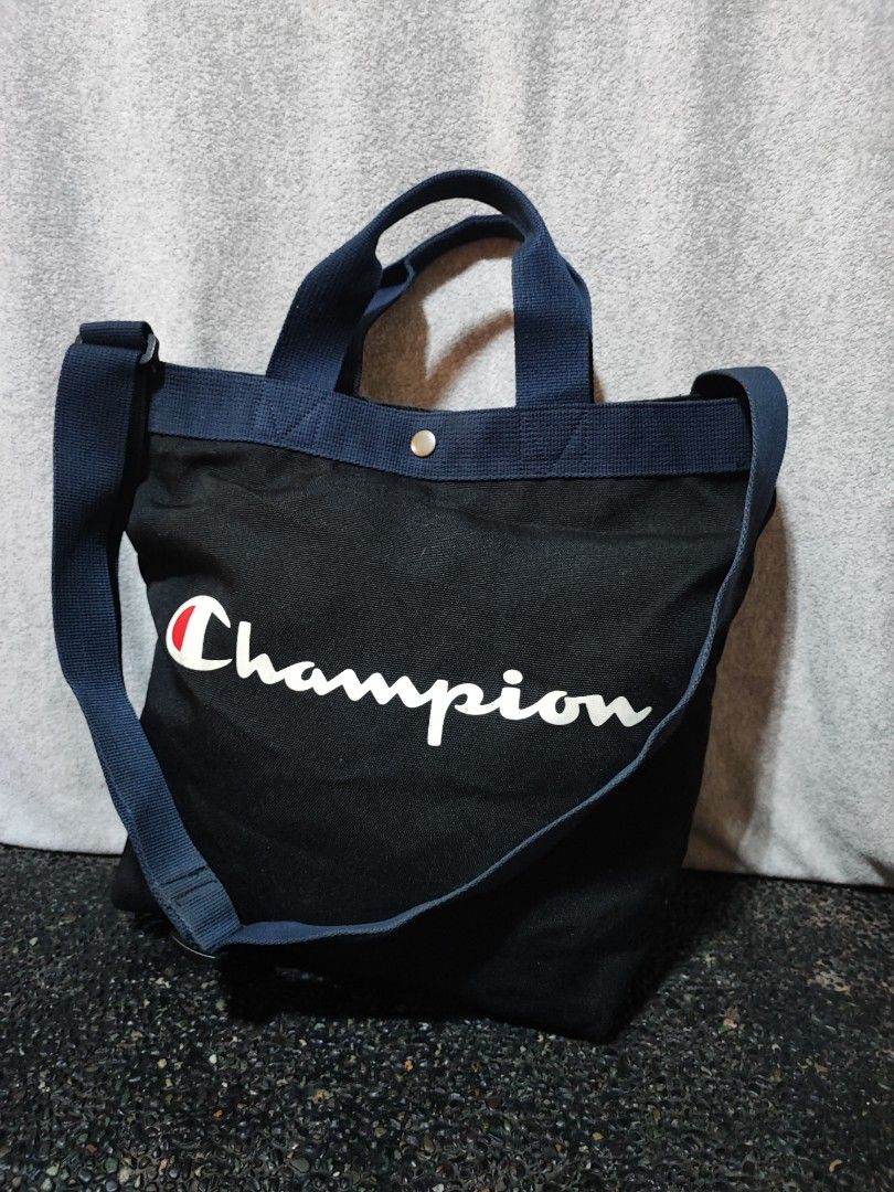 Champion Black and Blue Canvas Tote Bag (Category: Tote Bags) located in Baguio. Submitted by ozara.06 (Listing ID 1466735421, Image 1). Description: Champion 2 way canvas tote Excellent condition Medium near large 500.