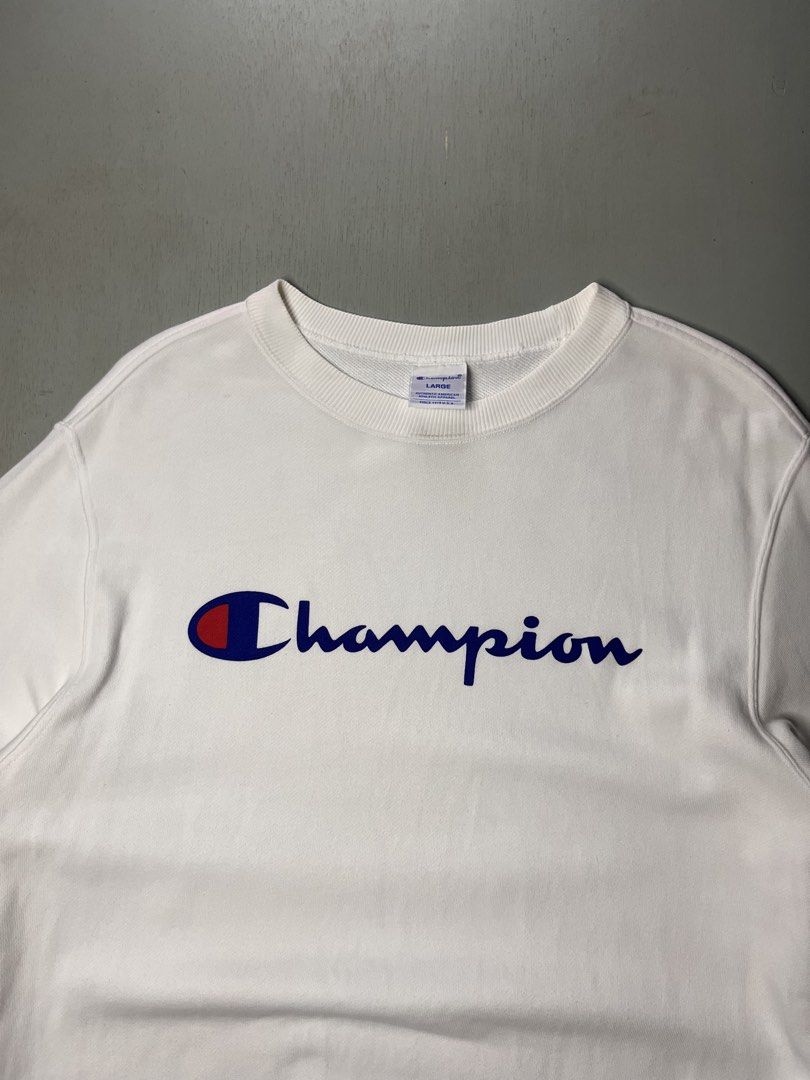 Champion White Script Logo Sweatshirt Size Large (Category: Coats, Jackets and Outerwear) located in Catbalogan. Submitted by yellfindss (Listing ID 1466741719, Image 3). Description: - Brand: Champion 20/27 - Style: Classic crewneck sweatshirt with script logo - Size: Large - Color: White - Condition: Clean fabric with comfy fleece interior - Details: Ribbed cuffs and hem, iconic embroidered sleeve patch - Perfect for: Cool weather layering.