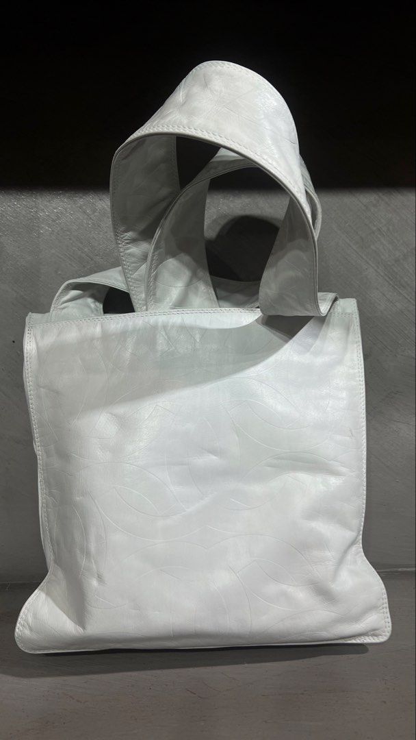 Chanel (Category: Sling Bags) located in Manila. Submitted by source.selection (Listing ID 1466764670, Image 3). Description: This is a vintage Chanel white lambskin leather crossbody bag featuring a large, subtly embossed interlocking CC logo under the front flap..