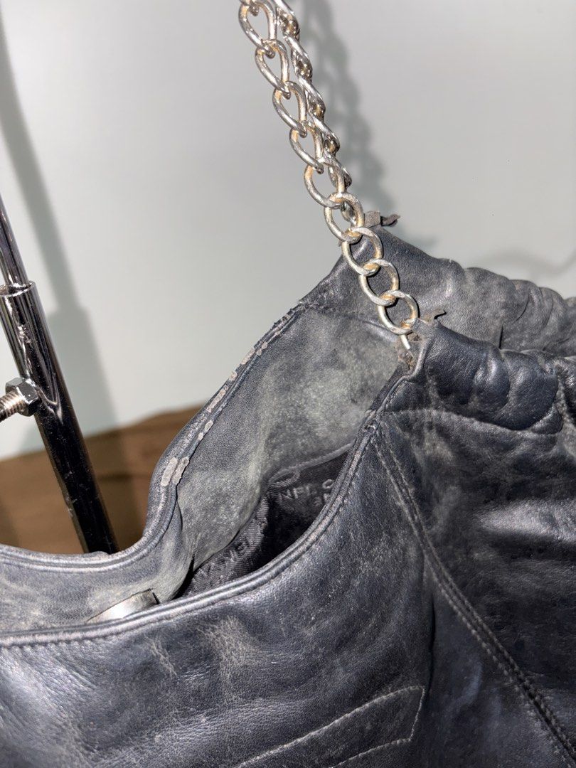 Chanel Black Leather Chain Shoulder Bag (Category: Luxury Bags & Wallets) located in Baguio. Submitted by maje_mori (Listing ID 1466704458, Image 3). Description: - Style: Chanel Shoulder bag / Drawstring bucket bag. - Condition: General wear on leather trim and edges; slight tarnish on chains (check photos for references)..