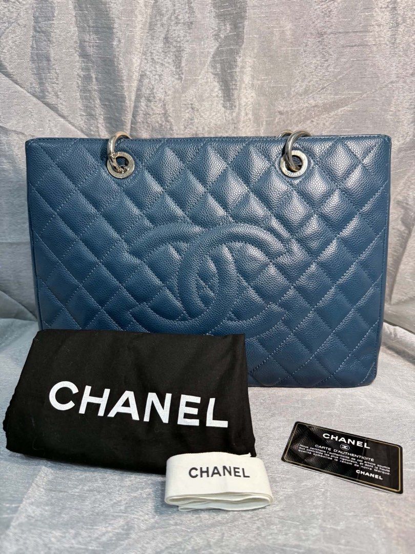 Chanel GST Caviar (Category: Wallets & Card holders) located in Las Pinas. Submitted by beatrice_z (Listing ID 1466590548, Image 1). Description: Chanel Grand Shopping Tote (GST) - Caviar Leather in original blue color - Hardware: Silver-tone - Condition: 7/10 (minor wear on bottom corners shown in photos) - Interior: Clean grey lining with zipped compartment and pockets - Inclusions: Dust bag, white ribbon, and authenticity card - Meetup Locatio