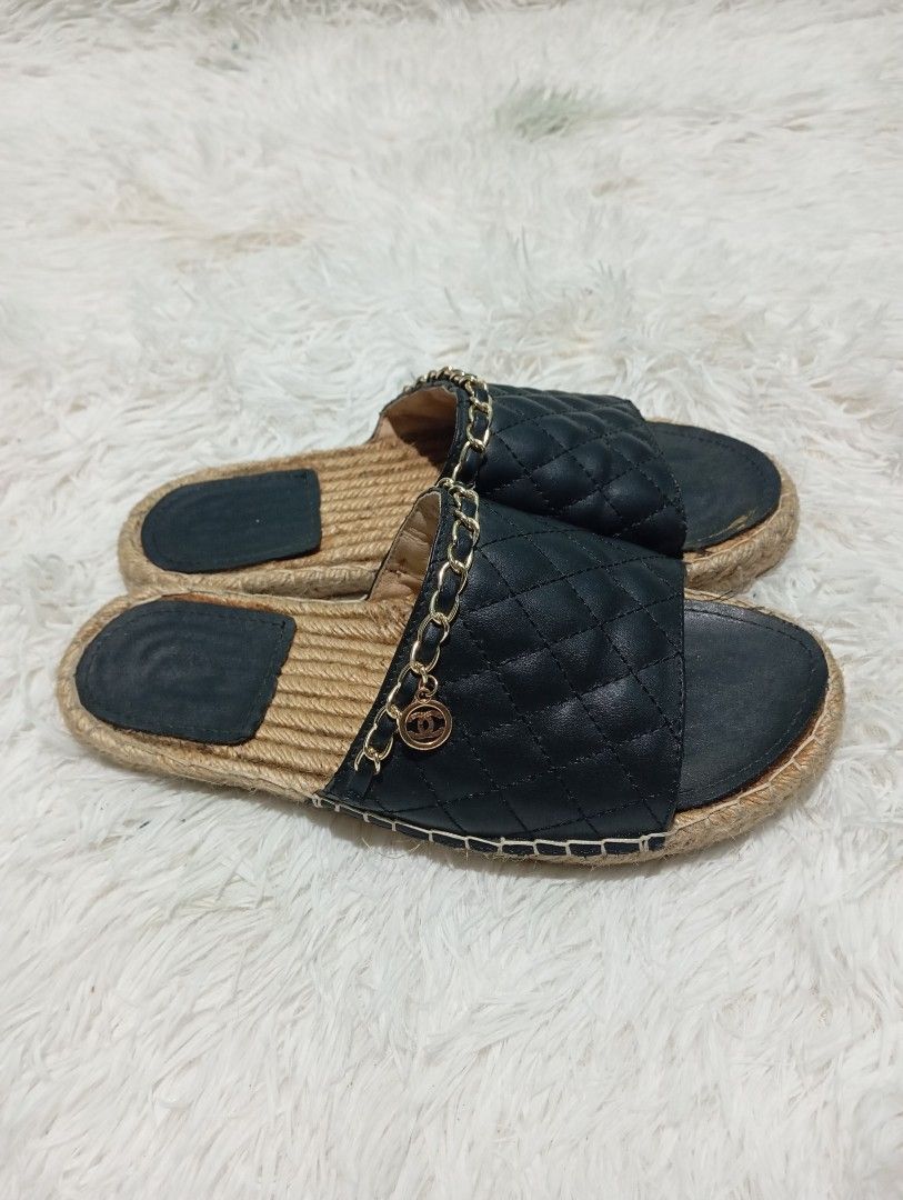 Chanel Quilted CC Chain Espadrille Mule / Slide (Category: Sneakers & Footwear) located in Quezon City. Submitted by thesecondmarketph (Listing ID 1466757330, Image 2). Description: - Style: Slip-on slide sandals - Color/Design: Black quilted upper with espadrille jute rope trim - Details: Woven gold chain accent featuring a hanging round interlocking CC logo charm - Soles: Flat with black inner footbeds - Condition: Worn a few times, with minor 