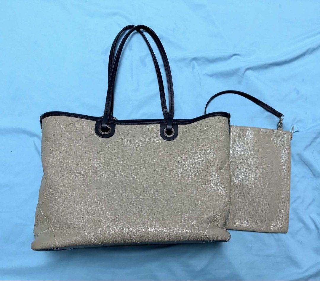 Chanel Tote Bag with Pouch (Category: Tote Bags) located in Marikina City. Submitted by mommymishy (Listing ID 1466564617, Image 1). Description: - Authentic Chanel beige quilted leather tote bag - Features dark trim handles and silver-tone hardware - Includes matching detachable pouch with strap and classic CC charm - Generous size with a structured shape, ideal for daily use Chanel tote bag caviar Comes with card and pouch Hologram intact Serie