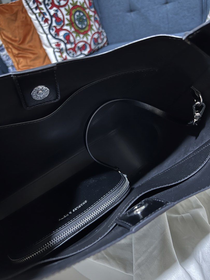 Charles & Keith Black HOBO Bag With Pouch (Category: Shoulder Bags) located in Davao. Submitted by bengscloset (Listing ID 1466649551, Image 3). Description: Brand: Charles & Keith Color: Black Material: Smooth faux leather with silver-tone hardware Details: Structured shoulder bag with magnetic closure & adjustable strap Inclusion: Matching zipped pouch and original dust bag Condition: Excellent, like new 📌 No rush shipping. 📦 Shipping fee c/o