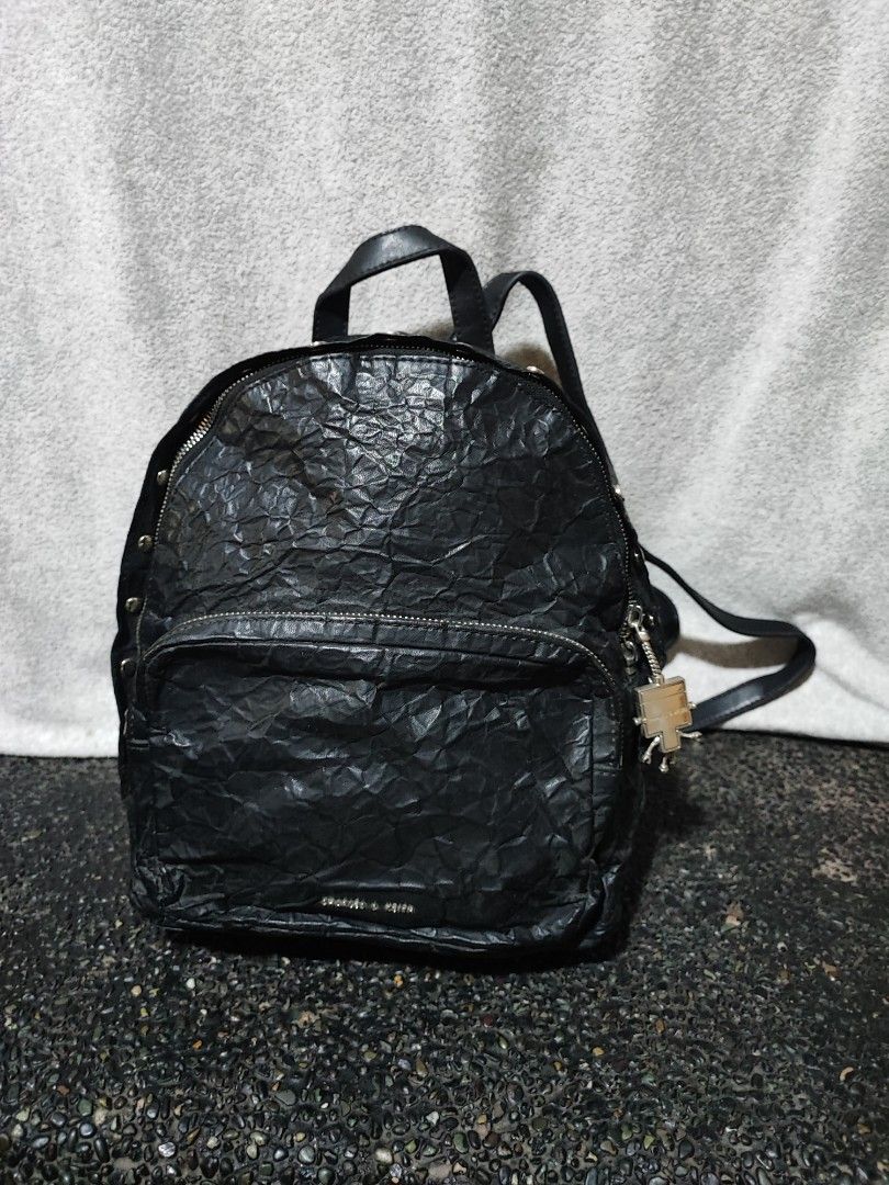 Charles & Keith Black Robot Charm Backpack (Category: Backpacks) located in Baguio. Submitted by ozara.06 (Listing ID 1466736587, Image 1). Description: Charles and Keith wrinkled small backpack Robot charm Very nice nito🥹 Excellent condition 1200.