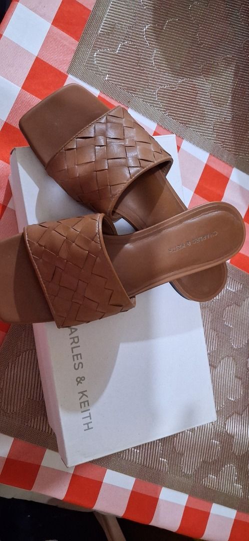 Charles & Keith Braided Square Toe Slides Tan Size 38 (Category: Flats & Sandals) located in Manila. Submitted by katkween23 (Listing ID 1466771891, Image 2). Description: - Brand: Charles & Keith - Style: Slip-on flat sandals with trendy square toe - Detail: Chic woven braided top strap - Size: EU 38 - Condition: Excellent, clean insoles with very minimal wear on soles - Inclusion: Original white branded box included.