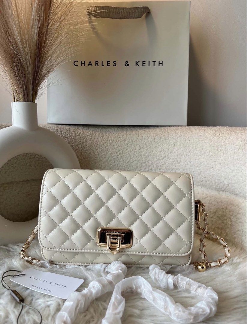 Charles & Keith Cressida Clutch Bag- Off white (Category: Clutches) located in Pasig City. Submitted by preloved.closet2 (Listing ID 1466770404, Image 1). Description: With Chain Sling Color Off white 9 inches Add paperbag plus 80 .