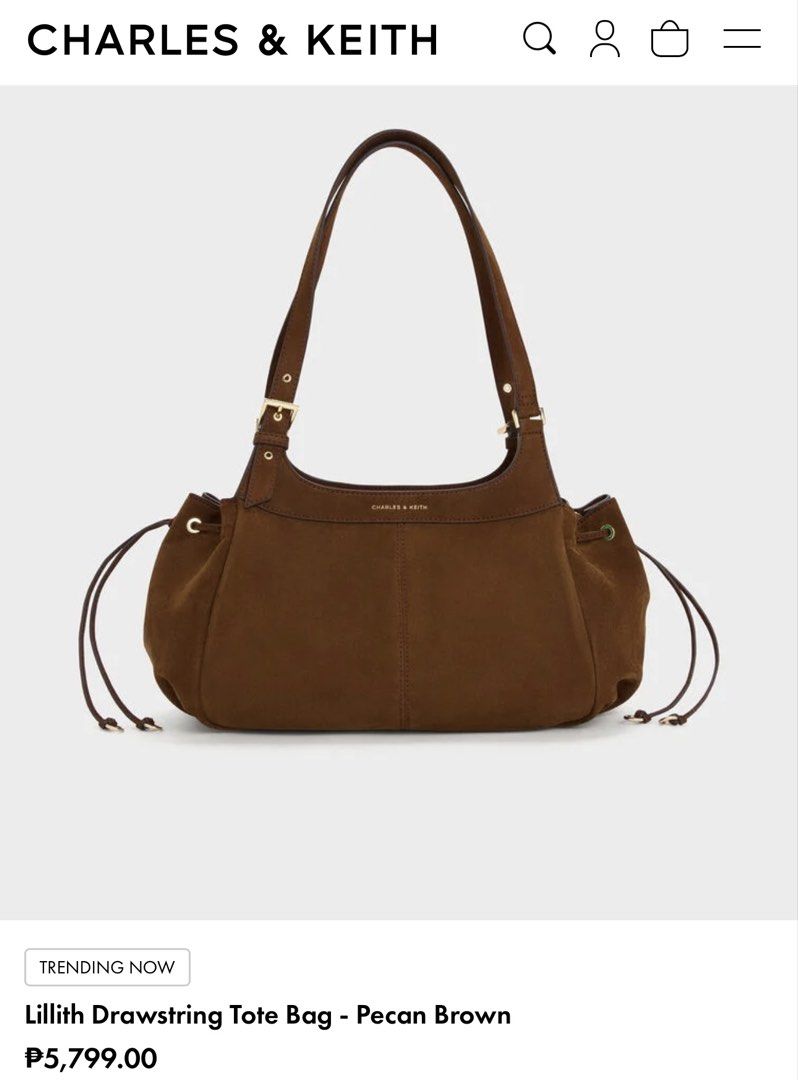 Charles & Keith Lilith Drawstring Tote Bag Pecan Brown (Category: Tote Bags) located in Malabon City. Submitted by tinxoxo (Listing ID 1466594339, Image 1). Description: USED ONCE ONLY SA EVENT. WITH DUSTBAG - Brand: Charles & Keith ORIGINAL - Model: Lilith Drawstring Tote Bag - Color: Rich Pecan Brown - Material: Soft suede with elegant gold-tone hardware - Storage: Spacious main compartment with zipper closure and handy internal pockets - Desig