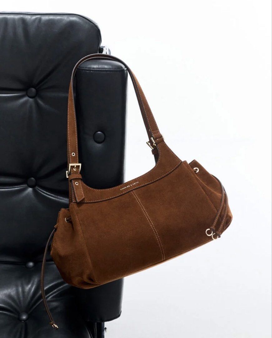 Charles & Keith Lilith Drawstring Tote Bag Pecan Brown (Category: Tote Bags) located in Malabon City. Submitted by tinxoxo (Listing ID 1466594339, Image 3). Description: USED ONCE ONLY SA EVENT. WITH DUSTBAG - Brand: Charles & Keith ORIGINAL - Model: Lilith Drawstring Tote Bag - Color: Rich Pecan Brown - Material: Soft suede with elegant gold-tone hardware - Storage: Spacious main compartment with zipper closure and handy internal pockets - Desig