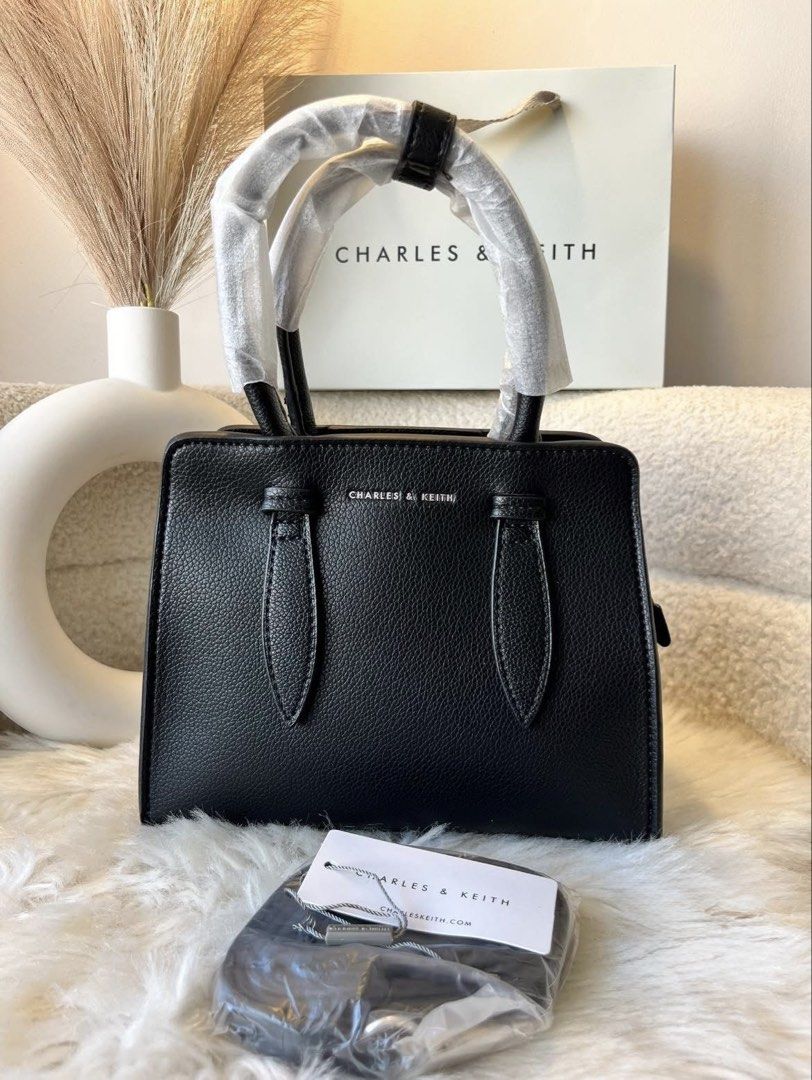 Charles & Keith Top Handle Bag- Black (Category: Shoulder Bags) located in Pasig City. Submitted by preloved.closet2 (Listing ID 1466770050, Image 1). Description: Top Handle Bag With Sling Color Black Add paperbag plus 80 .
