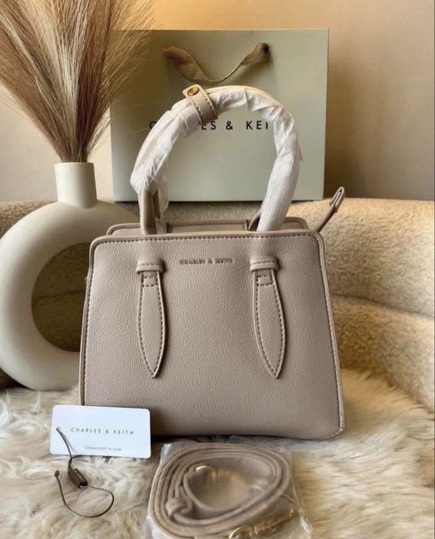 Charles & Keith Top Handle Bag- beige (Category: Shoulder Bags) located in Pasig City. Submitted by preloved.closet2 (Listing ID 1466770088, Image 1). Description: Top Handle Bag With Sling Color Beige Add paperbag plus 80 .
