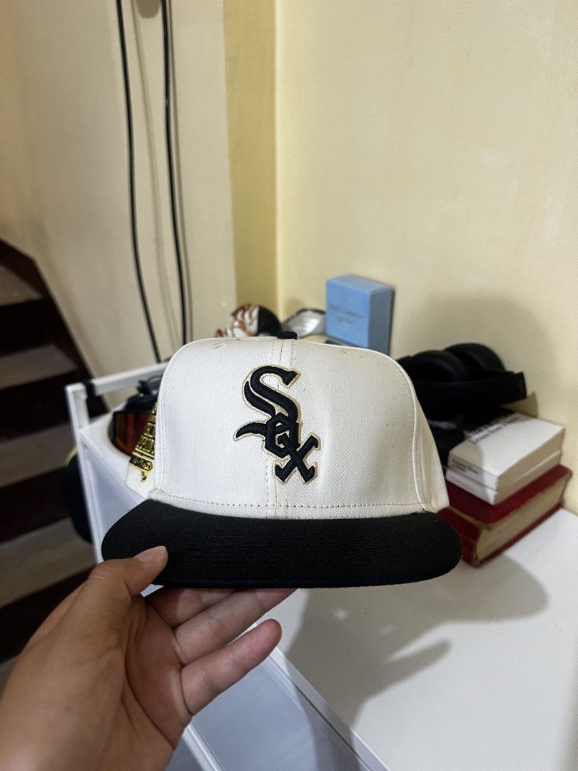 Chicago White Sox MLB Cooperstown Collection Snapback Cap (Category: Caps & Hats) located in Baler. Submitted by sidequester (Listing ID 1466583549, Image 1). Description: - Authentic MLB Cooperstown Collection Chicago White Sox snapback - Colorway: White crown, black brim, and vintage green underbrim - Features a commemorative 2005 World Series championship side patch - Adjustable plastic snapback closure for a customizable fit - MOP: Any online