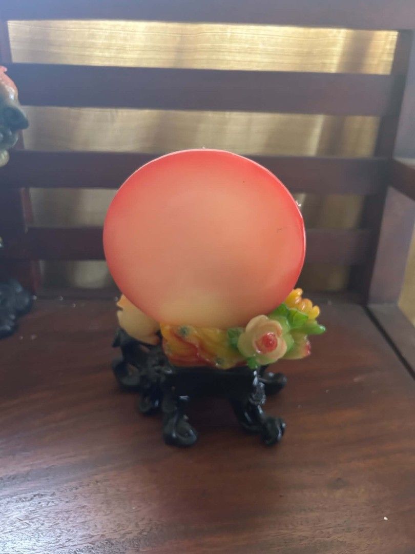 Chinese Jade Rabbit Figurine With Red Moon Backdrop (Category: Vintage Collectibles) located in Makati City. Submitted by YSL80022 (Listing ID 1466623204, Image 2). Description: - Elegant Chinese jade rabbit figurine resting on floral details - Features a striking red circular backdrop with traditional Chinese calligraphy - Mounted on a carved black decorative base with gold lettering on the front - Crafted from a heavy, premium resin or stone ma