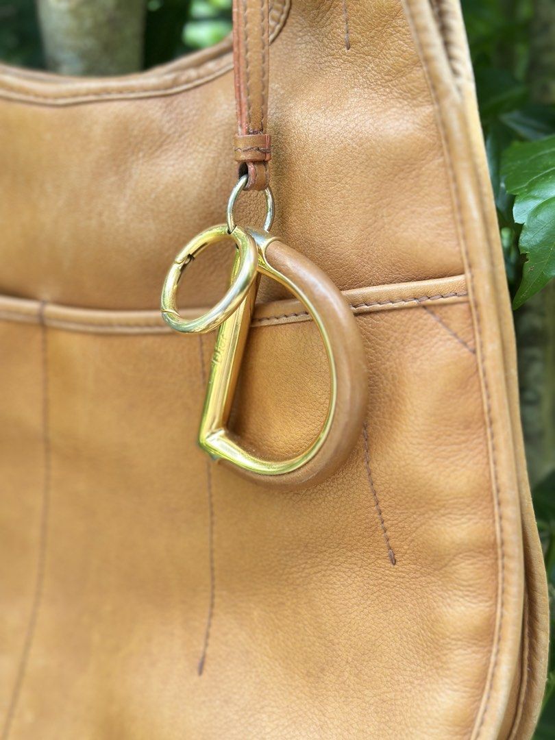 Christian dior tote 61 (Category: Luxury Bags & Wallets) located in Lantapan. Submitted by shanielsumatra16 (Listing ID 1466582976, Image 2). Description: Christian doir Tote 61 From the 2008 Collection by John Galliano Vintage Brown Leather Gold-Tone Hardware Rolled Handles Dual Exterior Pockets Nylon Lining & Three Interior Pockets Issue: penmark and minor scratch.