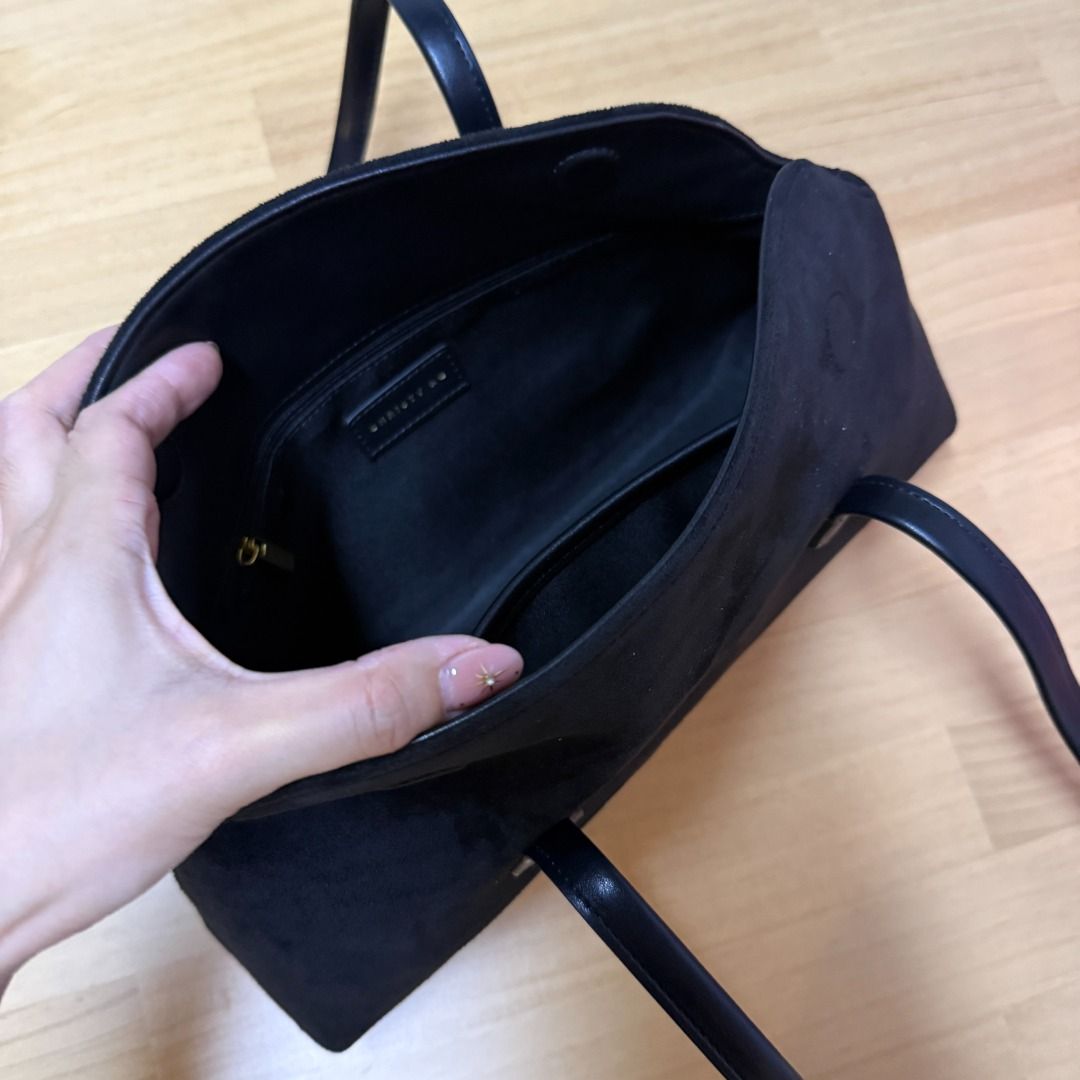 Christy Ng Black Edith Shoulder Bag (Category: Shoulder Bags) located in Mandaluyong City. Submitted by jldlnd (Listing ID 1466680718, Image 3). Description: Black Christy Ng shoulder bag in soft suede material. - Purchased from SM Megamall. Never used. - Includes original pink Christy Ng paper shopping bag. - RFS: decluttering before moving ❗️Lowballers will not be entertained❗️ .