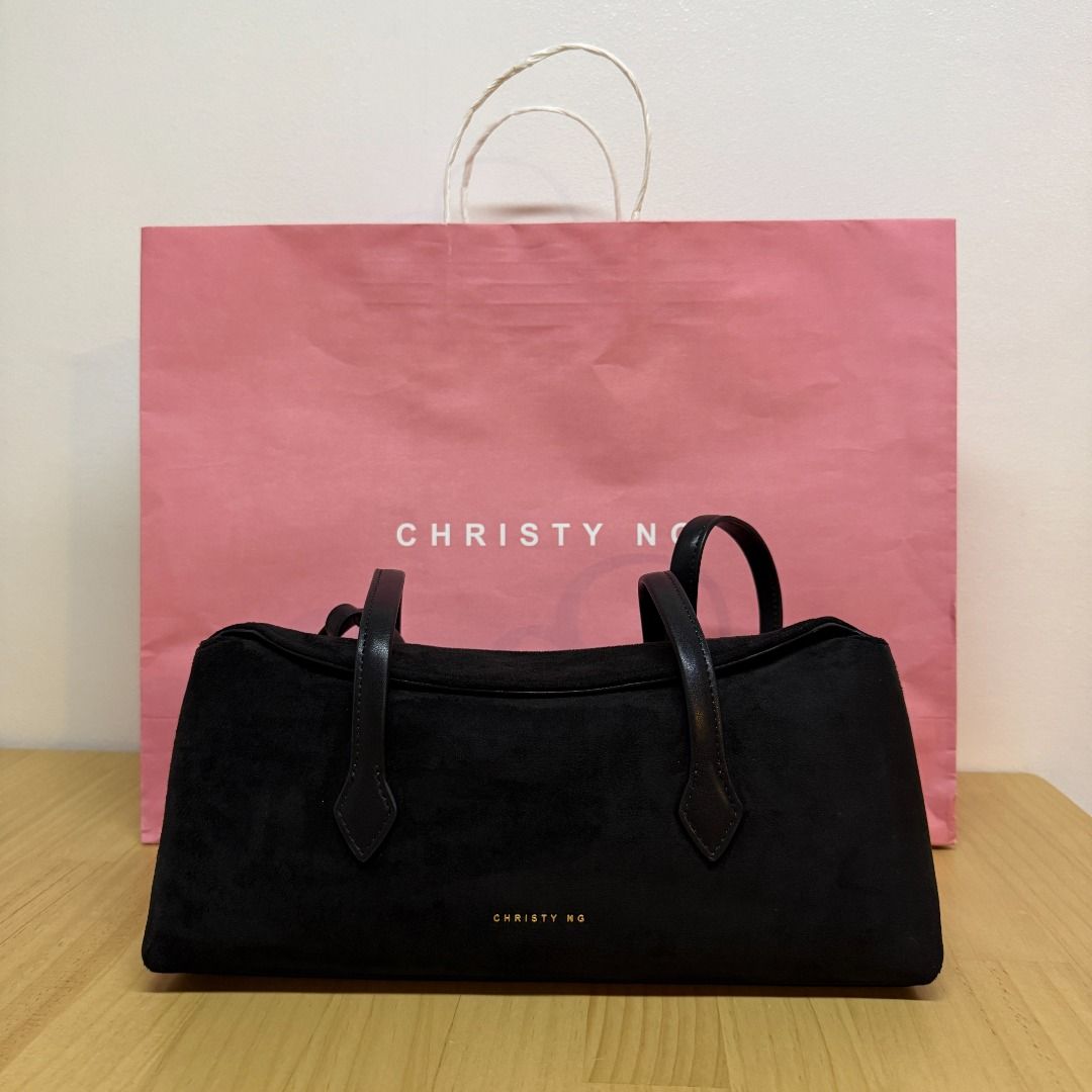 Christy Ng Black Edith Shoulder Bag (Category: Shoulder Bags) located in Mandaluyong City. Submitted by jldlnd (Listing ID 1466680718, Image 2). Description: Black Christy Ng shoulder bag in soft suede material. - Purchased from SM Megamall. Never used. - Includes original pink Christy Ng paper shopping bag. - RFS: decluttering before moving ❗️Lowballers will not be entertained❗️ .
