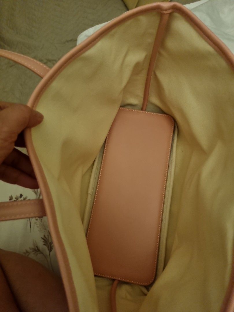 Christy Ng Russo Tote Bag Medium (Category: Shoulder Bags) located in San Juan City. Submitted by shannen.martinez (Listing ID 1466722514, Image 2). Description: pink christy ng shoulder russo tote bag medium size with pouch inside with dust bag.