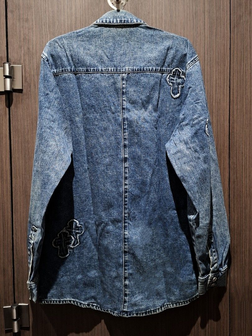 Chrome Hearts Denim Cross Patch Blue Work Shirt Jacket (Category: Coats, Jackets and Outerwear) located in Pasig City. Submitted by coveted.mnl (Listing ID 1466648117, Image 2). Description: In Pristine Condition📌 Best fit to: Large Width : 20 Length : 29 (MEASURED BY INCHES) 9.5/10 overall condition No issues or flaws in fabric • P4800 Slightly negotiable • Pasig City meet up • Open for COD Via Lalamove or Grab • J&T courier Message us for more