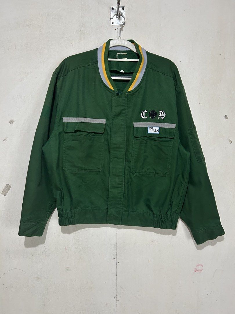 Chrome Hearts Green Work Jacket (Category: Coats, Jackets and Outerwear) located in Mandaluyong City. Submitted by 0lg2026 (Listing ID 1466750560, Image 3). Description: - Color: Green with striped ribbed collar - Branding: Chrome Hearts embroidery on chest and large dagger graphic on back - Safety/Detail: Reflective striping across front and back - Features: Button-down front closure, dual chest pockets, elasticized hem, and button cuffs - Measu