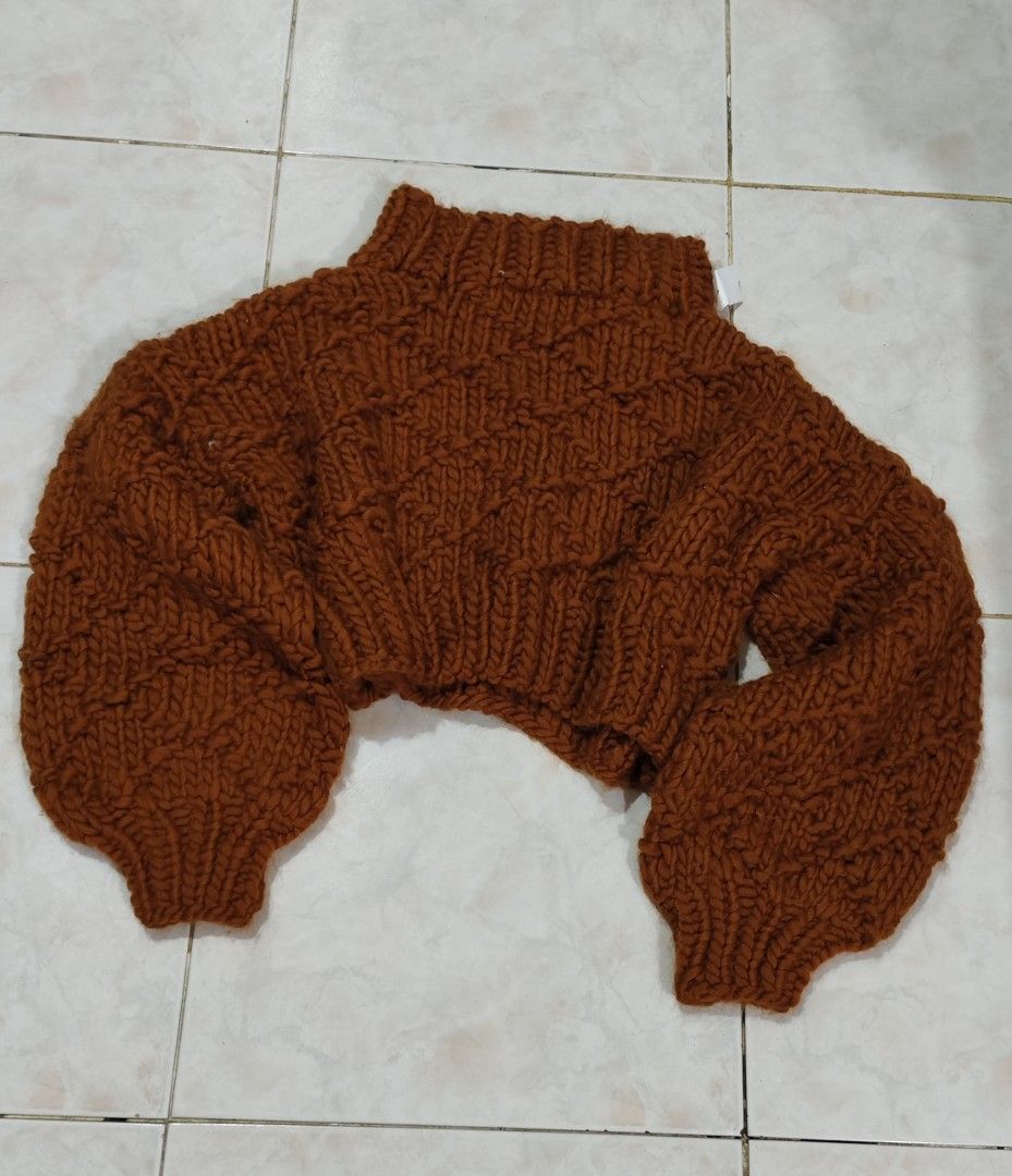Chunky Knit Cropped Turtleneck Sweater Rust Orange (Category: Coats, Jackets and Outerwear) located in Rodriguez. Submitted by bygollyfinds (Listing ID 1466565117, Image 1). Description: GREAT FOR WINTER/COLD SEASON Great for small-medium ________ - Color: Rich rust orange - Style: Chunky knit, mock turtleneck, cropped length - Details: Voluminous balloon sleeves, all-over diamond textured pattern, ribbed cuffs and hem - Material: Heavy, warm, an
