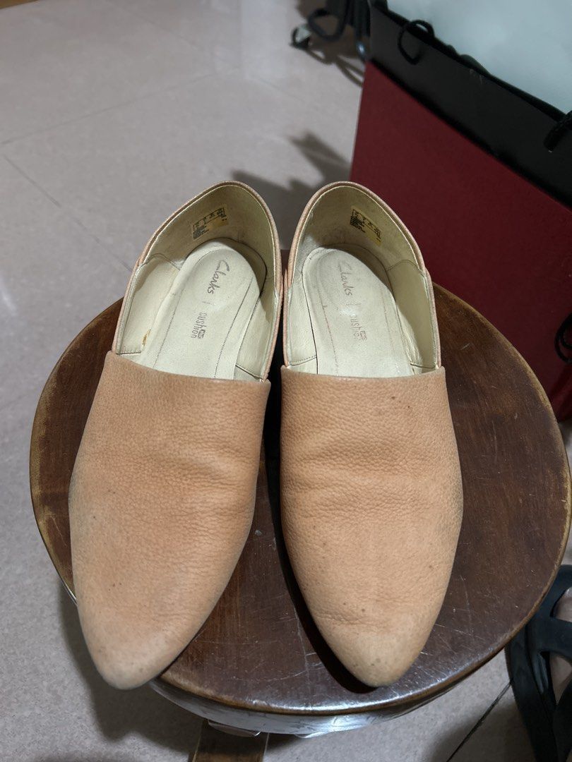 Clarks Cushion Soft Nude Wedge Flats (Category: Flats & Sandals) located in Alitagtag. Submitted by patrickvillanueva (Listing ID 1466615163, Image 1). Description: - Brand: Clarks - Style: Nude leather slip-on shoes with pointed toes and low wedge heels - Comfort: Cushion Soft insoles for all-day wearability - Material: Textured pebble leather upper in neutral beige - Condition: Worn a few times with minor scuffs on the toe area.