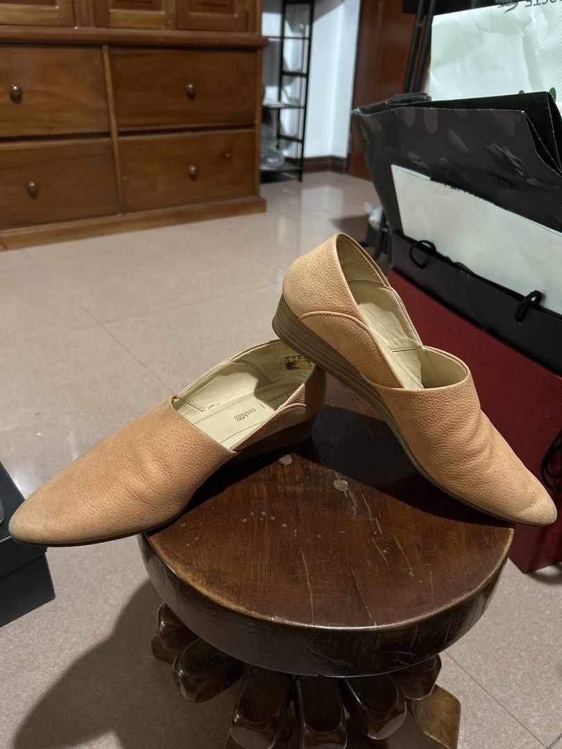 Clarks Cushion Soft Nude Wedge Flats (Category: Flats & Sandals) located in Alitagtag. Submitted by patrickvillanueva (Listing ID 1466615163, Image 2). Description: - Brand: Clarks - Style: Nude leather slip-on shoes with pointed toes and low wedge heels - Comfort: Cushion Soft insoles for all-day wearability - Material: Textured pebble leather upper in neutral beige - Condition: Worn a few times with minor scuffs on the toe area.