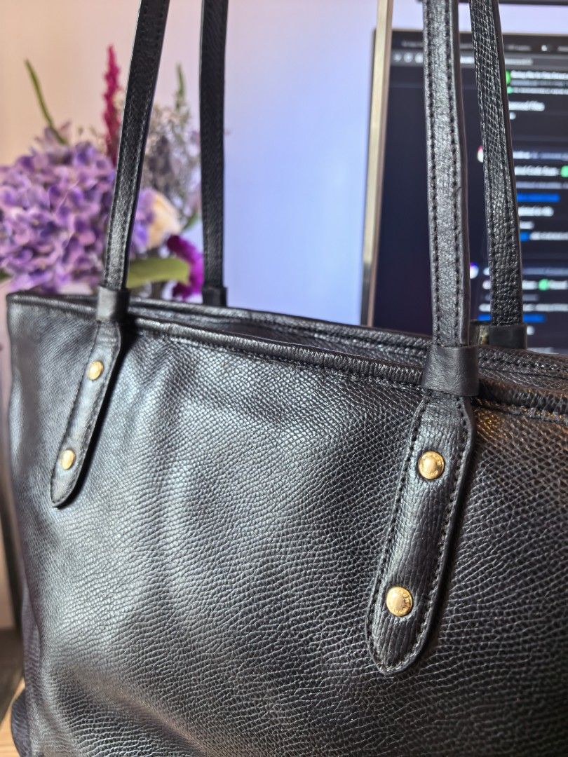 Coach City Zip Tote (Category: Luxury Bags & Wallets) located in Cavite. Submitted by inhinyera16 (Listing ID 1466689045, Image 3). Description: This was purchased from a thrift store and is being sold as-is. Please read the details carefully before purchasing: ⚠️ Authenticity Unverified: I cannot guarantee its authenticity as it was thrifted. Please use the photos to self-authenticate and judge for yourself. 📉 Condition: Shows minor scratches, 