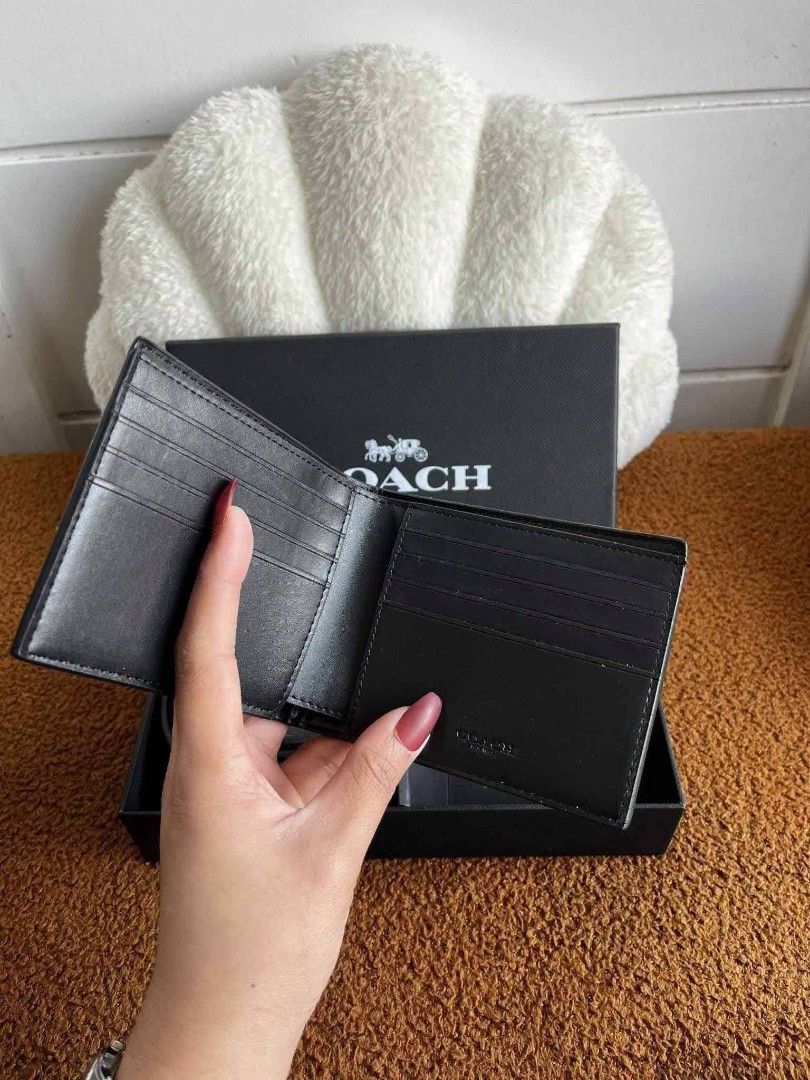 Coach Men's Wallet and Belt (Category: Wallets & Card Holders) located in Paoay. Submitted by rvf1230 (Listing ID 1466579052, Image 2). Description: - 100% Authentic Coach Gift Set - Reversible black leather belt with a sleek gunmetal buckle - Signature monogram wallet equipped with multiple card slots - Beautifully packed in an original black Coach presentation box with white branding - Brand new and ready to gift.