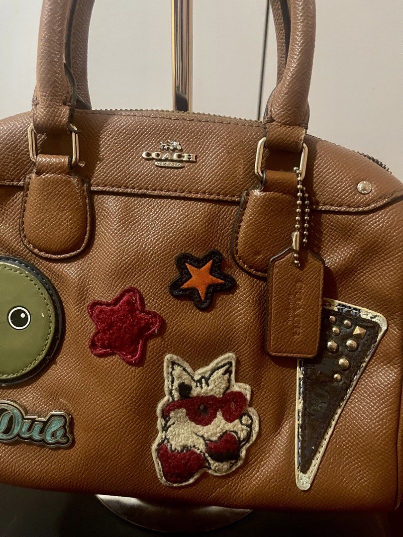 Coach Mini Bennett Satchel (Category: Luxury Bags & Wallets) located in Lucena. Submitted by bestfindsbyellie (Listing ID 1466672409, Image 2). Description: Authentic Coach In great condition With its original hangtag and sling Can be used a cross-body or hand bag in beautiful choco-brown color with cute patches design 600 only with free sf (non-negotiable) shipping via J&T location: Lucena.