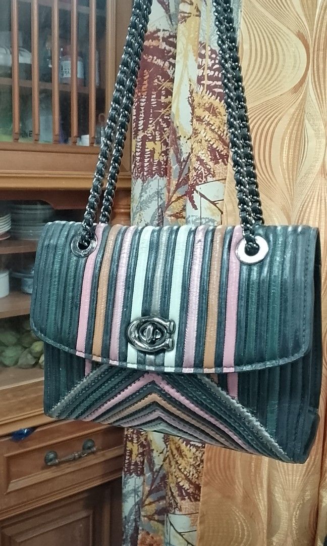 Coach rainbow parker (Category: Luxury Bags & Wallets) located in Manila. Submitted by annemil_1984 (Listing ID 1465080619, Image 1). Description: - Authentic Coach colorblock shoulder bag - Premium rainbow design shoulder bag - Structured rectangular shape offering great everyday capacity - Well-maintained and carefully stored - Perfect statement piece for any outfit - Feel free to send a message for more photos or inquiries!.