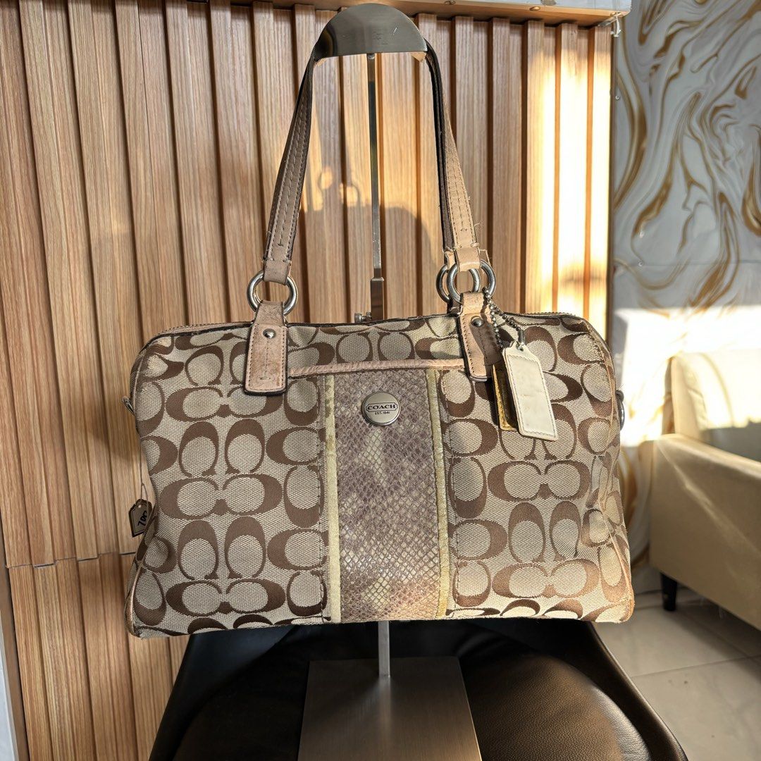 Coach Signature C Monogram Satchel with Python Print Panel (Category: Luxury Bags & Wallets) located in Bambang. Submitted by heats777 (Listing ID 1466664132, Image 1). Description: - Authentic Coach signature C monogram canvas satchel - Classic beige and brown colorway - Eye-catching center vertical panel with textured python-embossed pattern and metallic gold trim - Comfortable dual leather shoulder straps with sturdy metal hardware rings - Sec