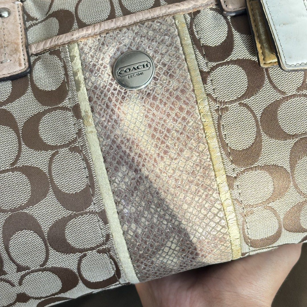 Coach Signature C Monogram Satchel with Python Print Panel (Category: Luxury Bags & Wallets) located in Bambang. Submitted by heats777 (Listing ID 1466664132, Image 2). Description: - Authentic Coach signature C monogram canvas satchel - Classic beige and brown colorway - Eye-catching center vertical panel with textured python-embossed pattern and metallic gold trim - Comfortable dual leather shoulder straps with sturdy metal hardware rings - Sec