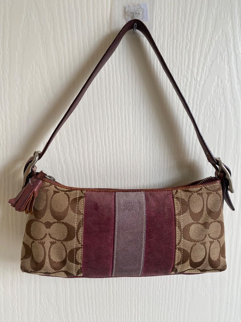 Coach Signature C Suede Stripe Shoulder (Category: Shoulder Bags) located in Caloocan City. Submitted by elisza.77wzd (Listing ID 1466746714, Image 1). Description: Authentic Coach Y2K shoulder bag featuring signature C canvas, pink and brown suede panels, and brown leather strap with a tassel accent. Zip top closure with silver hardware. Stylish and compact for everyday use. Message for inquiries!.