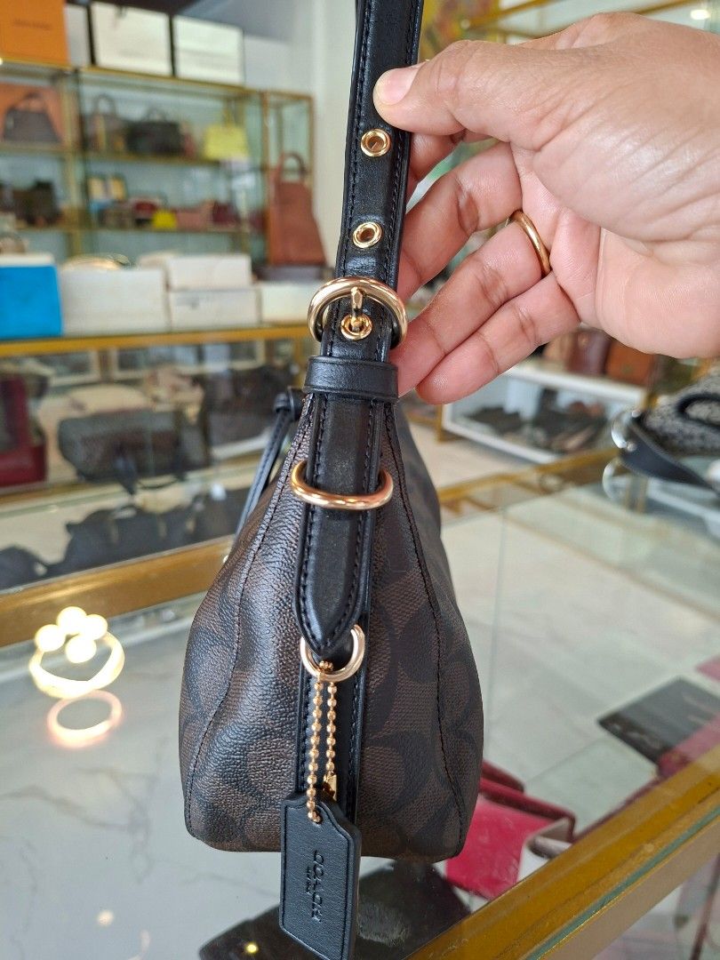 Coach Signature Monogram Brown Black Shoulder Bag (Category: Luxury Bags & Wallets) located in Tagum. Submitted by marny0503-00673 (Listing ID 1466594530, Image 2). Description: Authentic 💯💯💯 In almost new condition ❣️.
