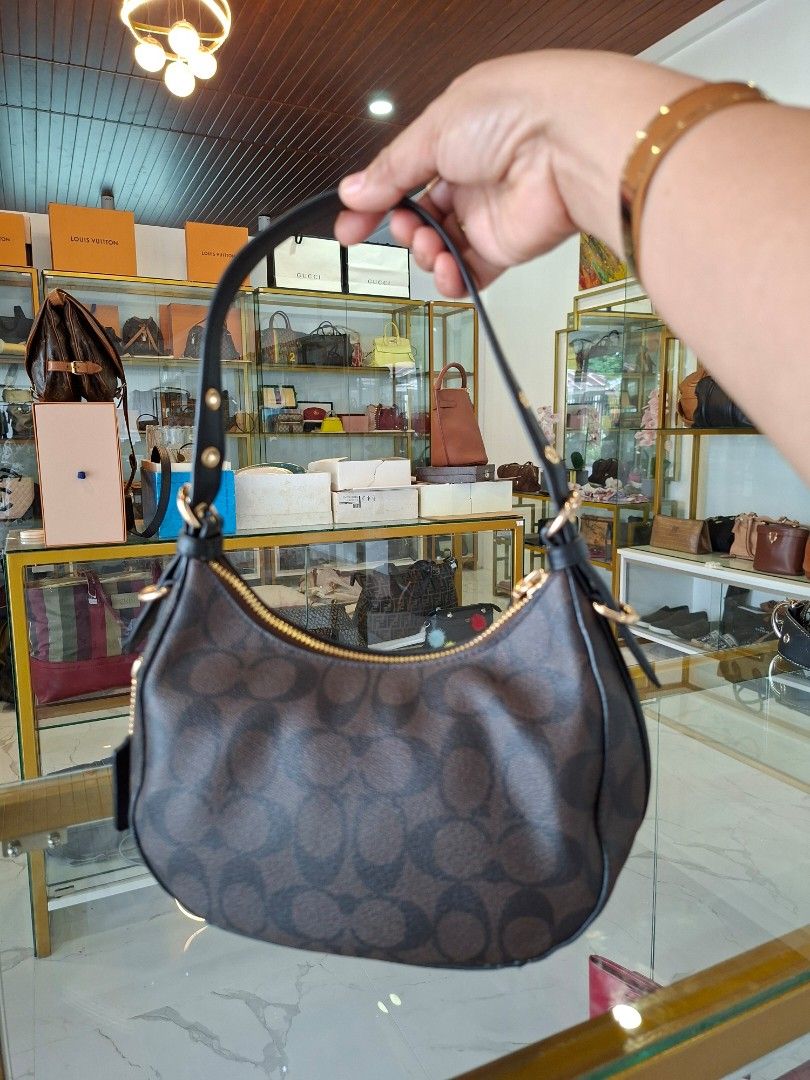 Coach Signature Monogram Brown Black Shoulder Bag (Category: Luxury Bags & Wallets) located in Tagum. Submitted by marny0503-00673 (Listing ID 1466594530, Image 3). Description: Authentic 💯💯💯 In almost new condition ❣️.