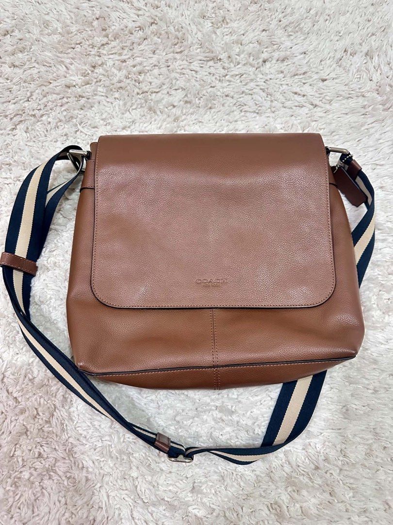 Coach Messenger Bag for Men (Category: Sling Bags) located in Makati City. Submitted by pabi.gar (Listing ID 1466581332, Image 2). Description: Coach Messenger Bag for Men Color: Brown Material: Leather Condition: Like New Usage: Used twice only Measurement: L 12.5” | W 3.5” | 11” Inclusions: None (bag only) Guaranteed Authentic bought in Vancouver, Canada (I personally bought this for my husband) RFS: Not using anymore One of Coach’s OG design f