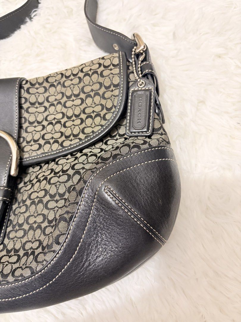 Coach Soho In black gray jacquard (Category: Luxury Bags & Wallets) located in General Santos City (Dadiangas). Submitted by thriftqueen5897 (Listing ID 1466715778, Image 3). Description: Minimal cracks in rubber lining. .