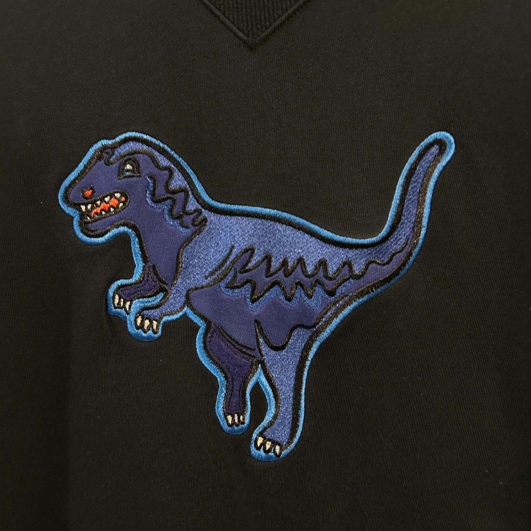 Coach Sweatshirt Blue Embroidered Rexy Dinosaur Pullover (Category: Coats, Jackets and Outerwear) located in Quezon City. Submitted by streetwearandluxph (Listing ID 1466563945, Image 2). Description: Coach Sweatshirt Blue Embroidered Rexy Dinosaur Pullover.