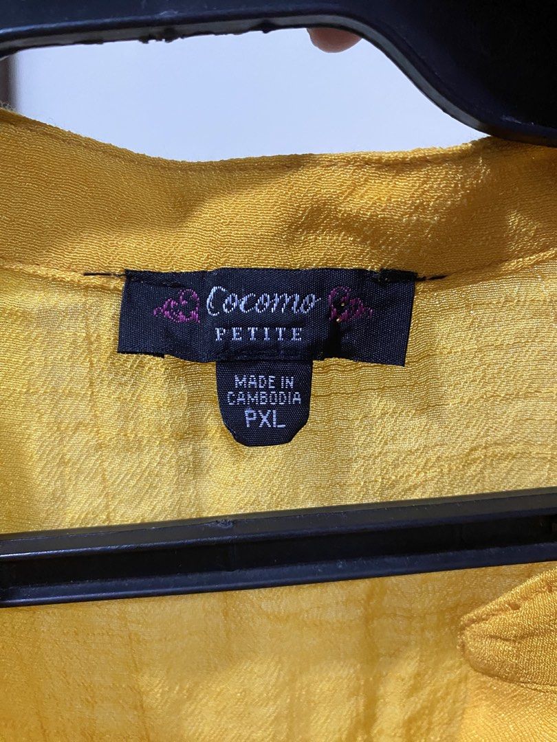 Cocomo Petite Yellow Button-Down Blouse PXL (Category: Blouses) located in Manila. Submitted by divinemercy_29 (Listing ID 1466634268, Image 3). Description: - Brand: Cocomo Petite - Size: PXL - Color: Bright Yellow - Material: Lightweight textured fabric - Origin: Made in Cambodia - Details: 4-button neckline placket, front pleats, back yoke gathers, and long sleeves with gathered cuffs - Fit: Flowy and comfortable - Never worn however no more t