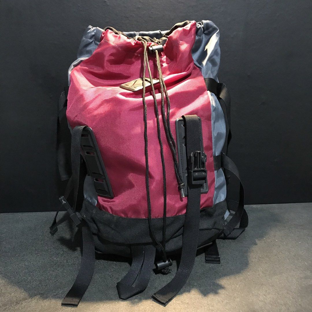 Colorblock Drawstring Backpack Red Grey Black (Category: Backpacks) located in Baao. Submitted by all.things.japan (Listing ID 1466712552, Image 1). Description: 17.0 x 12.0 x 6.0 inches -Trendy multi-color design featuring red, grey, and black panels - Secure top drawstring closure with a convenient toggle lock - Stylish front exterior with utility straps, buckles, and a diamond patch - Comfortable, adjustable padded shoulder straps for all-day 