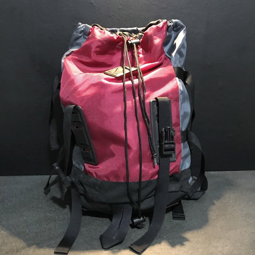 Colorblock Drawstring Backpack Red Grey Black (Category: Backpacks) located in Baao. Submitted by all.things.japan (Listing ID 1466712552, Image 2). Description: 17.0 x 12.0 x 6.0 inches -Trendy multi-color design featuring red, grey, and black panels - Secure top drawstring closure with a convenient toggle lock - Stylish front exterior with utility straps, buckles, and a diamond patch - Comfortable, adjustable padded shoulder straps for all-day 
