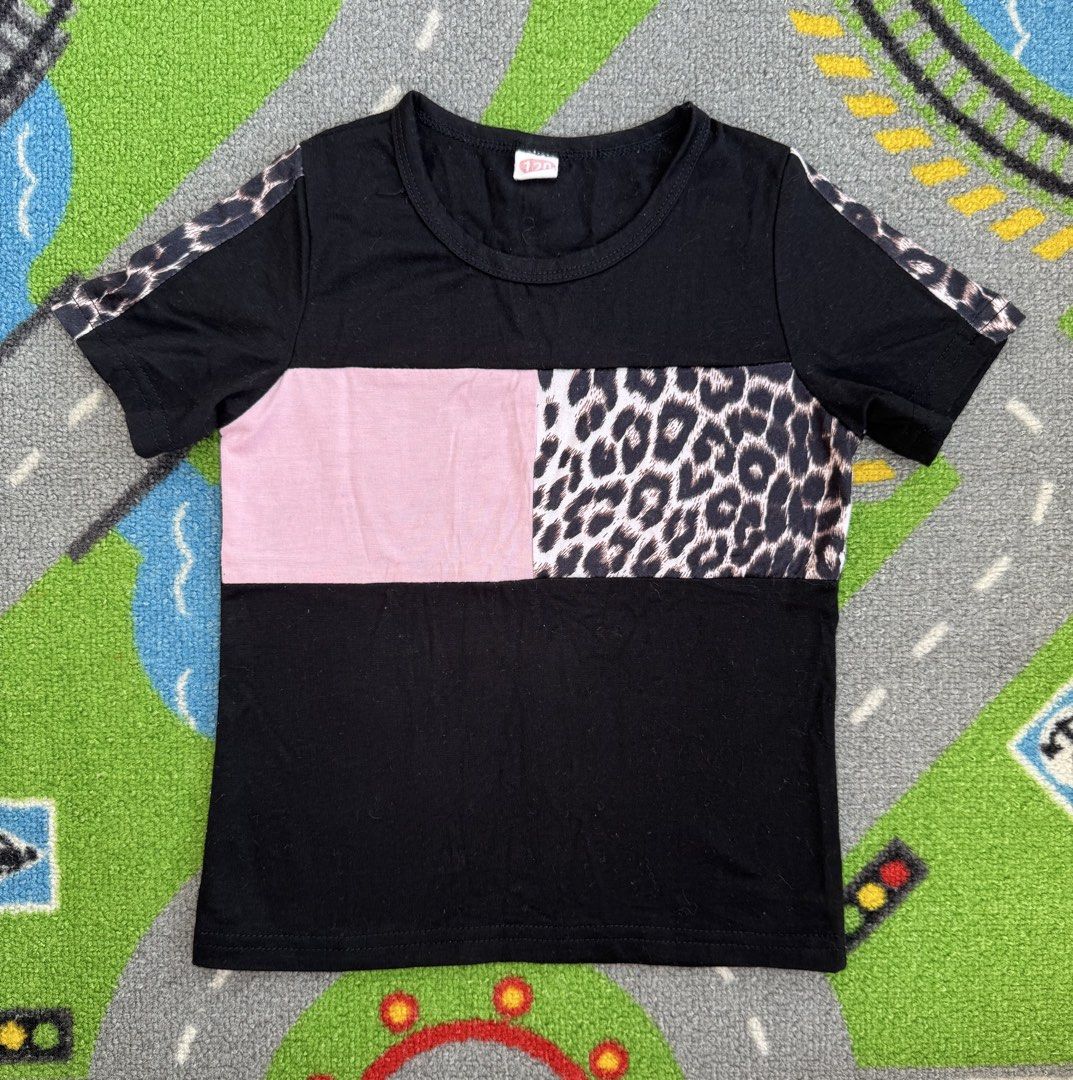Colorblock Leopard Print T-Shirt (Category: Babies & Kids Fashion) located in Rizal. Submitted by preloovved (Listing ID 1466678331, Image 1). Description: Preloved, 2yo, Chic black short sleeve tee featuring a bold pink and leopard print chest panel and matching sleeve stripes. Made from a comfortable cotton blend in a standard fit. Perfect for casual everyday wear. C-2.