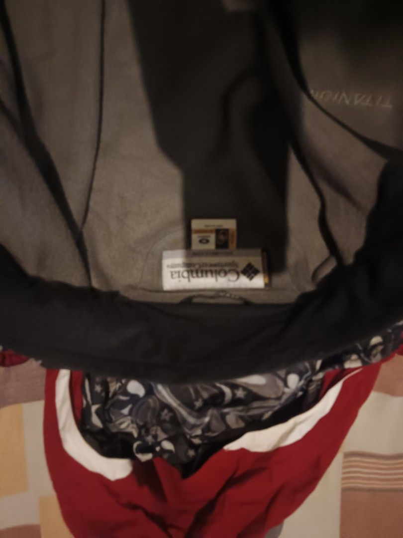 Columbia titanium jacket (Category: Activewear) located in Odiongan. Submitted by thriftngo26 (Listing ID 1466770137, Image 3). Description: This appears to be a red and white Columbia Titanium Omni-Tech interchange winter ski jacket with a detachable hood and an inner gray fleece layer.