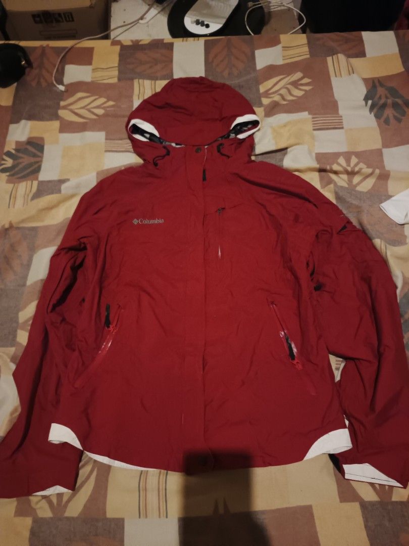 Columbia titanium jacket (Category: Activewear) located in Odiongan. Submitted by thriftngo26 (Listing ID 1466770137, Image 1). Description: This appears to be a red and white Columbia Titanium Omni-Tech interchange winter ski jacket with a detachable hood and an inner gray fleece layer.