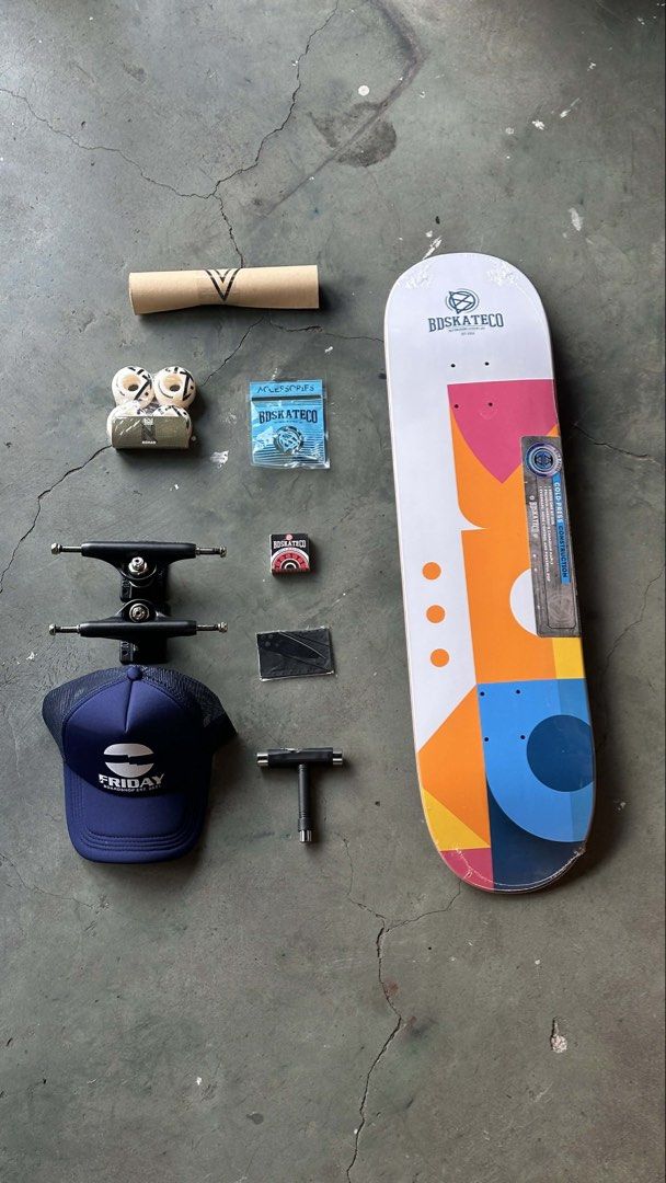Complete Skateboard Bundle and Accessories (Category: Skates, Rollerblades & Scooters) located in Mandaluyong City. Submitted by dhanlumanas (Listing ID 1466770858, Image 3). Description: Full setup including Nomad deck, black trucks, white wheels, bearings, grip tape, hardware, T-tool, and Friday Boardshop cap. Everything still wrapped and unused in original packaging. Great bundle for building a fresh board right away..