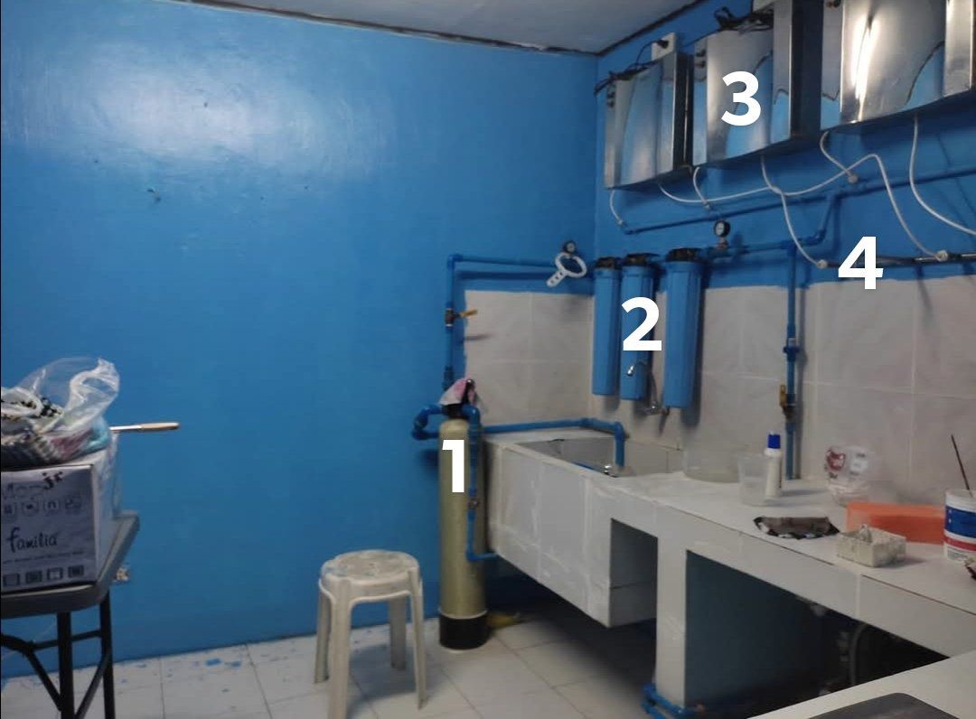 Complete Water Filtration and Purification Setup (Category: Water Purifiers & Dispensers) located in Manila. Submitted by venzonnen14189 (Listing ID 1466766360, Image 1). Description: - Complete wall-mounted water filtration setup ready for installation - Includes sediment tank, triple filter housings, and stainless steel purifier units - Neatly connected with blue PVC piping (all pictured hardware included) - Ideal for home or business concrete 
